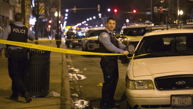 A Chicago police officer at the scene where an officer shot and killed 16-year-old Pierre Loury on Monday. 