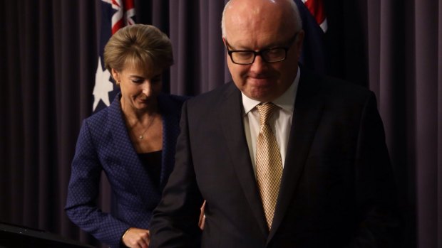 Attorney-General George Brandis and the Minister Assisting the Prime Minister for Women Michaelia Cash announcing the cuts reversal on Thursday.
