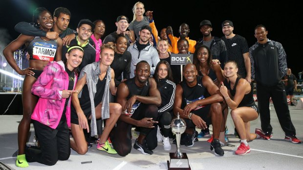 Usain Bolt and his All-Stars team celebrate their win after the final round of competition at Lakeside Stadium on Saturday night.