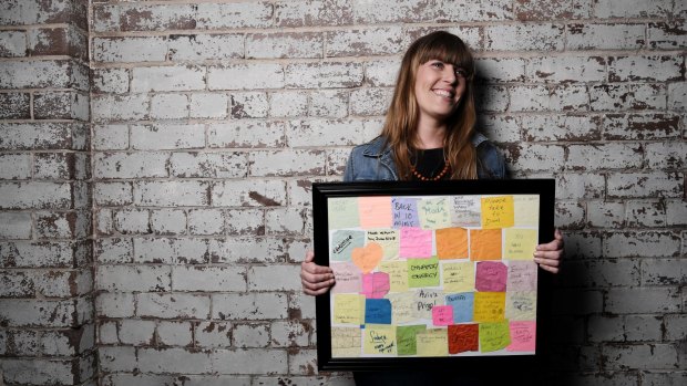 Artist Laura Sullivan and some of the notes she has found on the streets over the past 12 years. 