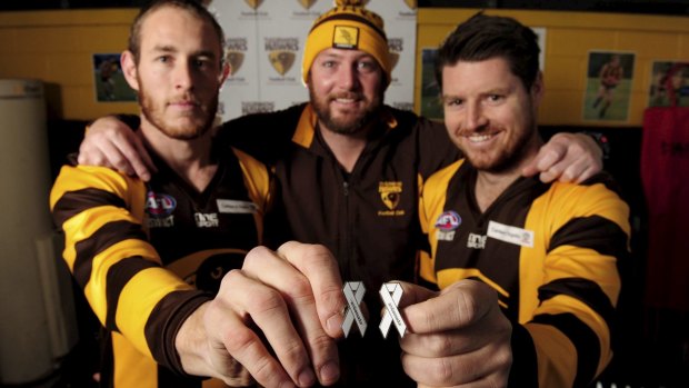 Tuggeranong Hawks will be supporting the White Ribbon round this weekend. From left, captain Chris Robinson, coach Nathan Costigan and vice-captain Ash Pocock.