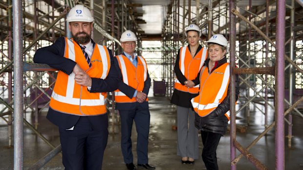 National development management officer for Calvary Angus Bradley, Calvary Canberra private CEO Shaune Gillespie, clinical services director Rowena Dyer, and Calvary public CEO Karen Edwards at the site inspection for the new Calvary Private Hospital.