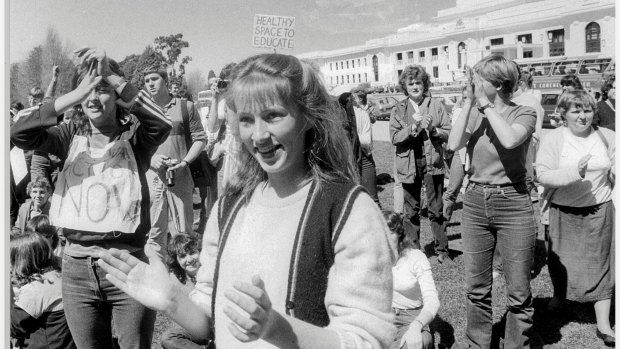 Students from Narrabundah College break into applause outside Parliament House on the September 21, 1983 after they learnt the government was taking action on the presence of asbestos in the school. 