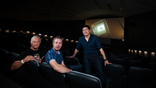 ANU Film Group members, from left,  Brett Yeats, secretary Andrew Wellington and President Adrian Ma, in the Coombs Theatre.