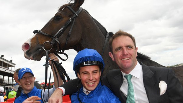 All smiles: William Buick, trainer Charlie Appleby and Francis Of Assisi.