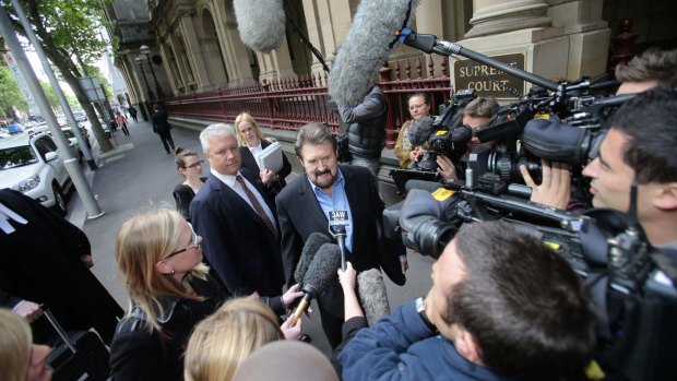 Hinch arrives at court to face charges of contempt over the naming of a sex offender in 2013.