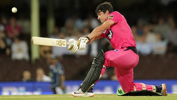 Moises Henriques of the Sixers hits a six during the Big Bash League match between the Sydney Sixers and the Melbourne Stars.
