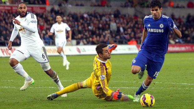 Prolific: Diego Costa rounds Swansea`s Polish goalkeeper to score his team's third goal.