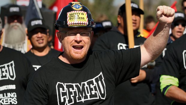 CFMEU secretary Dean Hall leads construction workers in a march at the National Day of Mourning march in 2012.