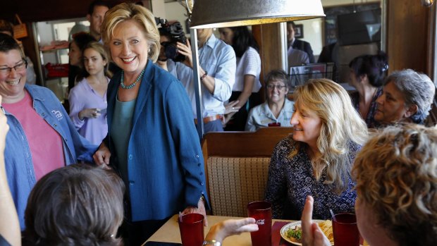 Democratic presidential candidate Hillary Clinton talks with customers during a campaign stop in Laconia, New Hampshire, on Thursday. 