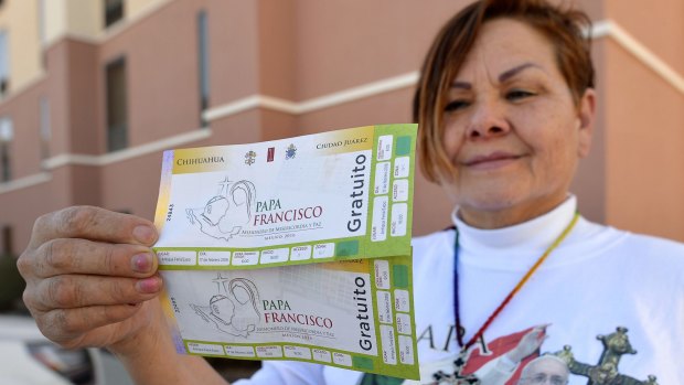 Fort Worth pilgrim Rosa Foulks shows her tickets to Wednesday's Papal mass in Ciudad Juarez, Mexico.