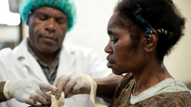 Another patient receives treatment at the MSF-run Hospital in Tari, after her husband attacked her. In PNG, disturbing levels of family and sexual violence are directed towards women and children.