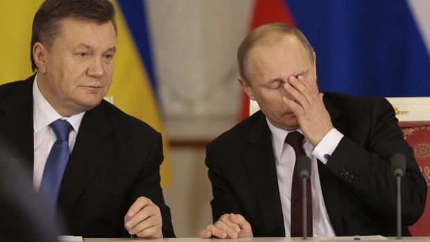 Russian President Vladimir Putin, right, and his Ukrainian counterpart Viktor Yanukovych in Moscow in 2013, where Yanukovych now lives.