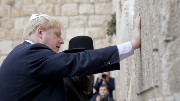Mayor of London Boris Johnson touches the Western Wall in Jerusalem on Wednesday. 