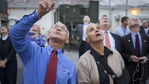 NASA Administrator Charles Bolden and his wife Jackie Bolden watch as the United Launch Alliance Delta 4-Heavy rocket, with NASA's Orion spacecraft mounted atop, lifts off from the Cape Canaveral Air Force Station.