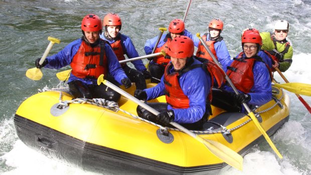 Tongariro River Rafting trip with owner Garth Oakden in yellow at the back.