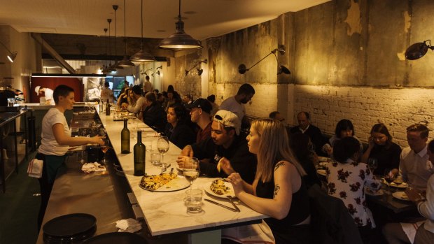 Diners at Bella Brutta can see chefs in full flight slinging pizza into the wood-fired oven.