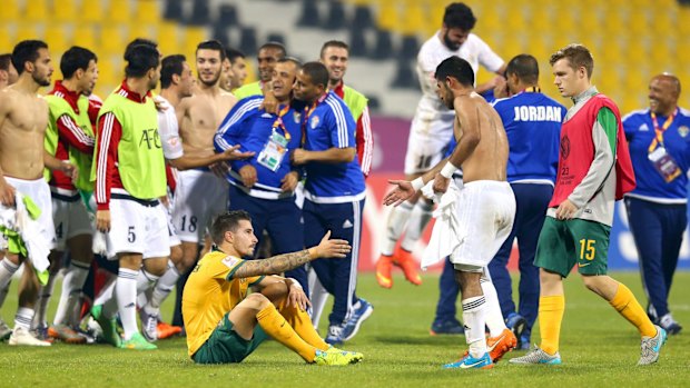 Painful: The Olyroos come to terms with failing to qualify for the Olympics after drawing with Jordan.