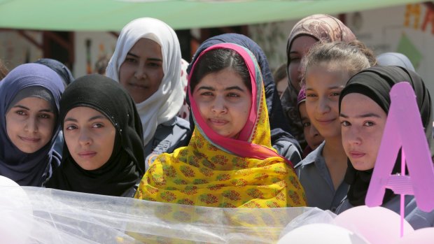 Nobel Peace Prize laureate Malala Yousafzai (centre) with girls at a school for Syrian refugee girls, built by the NGO Kayany Foundation,  in Lebanon's Bekaa Valley.