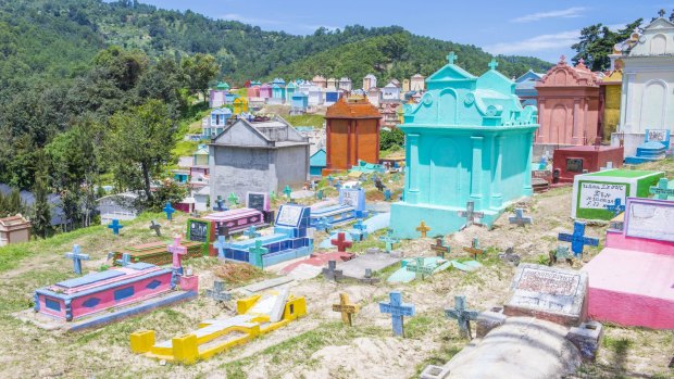 In Guatemala, family members paint the tombstone as a way of honoring the dead.