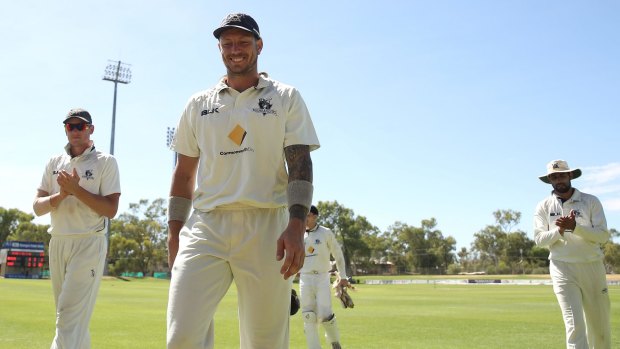 The Bushrangers'  James Pattinson is applauded by his teammates after taking five wickets in the second innings during the Sheffield Shield match against Western Australia in Alice Springs.