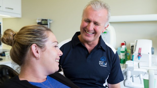 Dr David Digges with Danielle Valia, in his dental surgery. He formed a national network of 100 dentists who donate a day or two a year to provide free care to those who can't access or afford timely care.