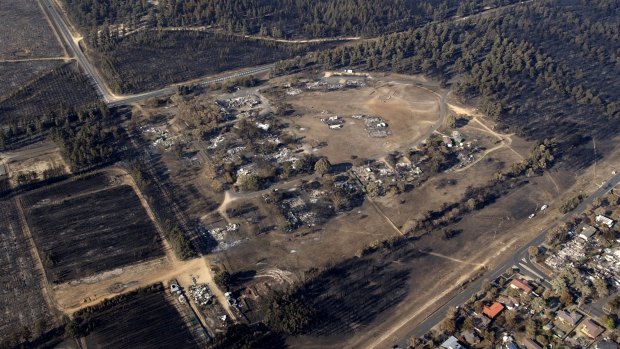 The Stromlo settlement, and the outskirts of Duffy after the fire on January 28, 2003. 