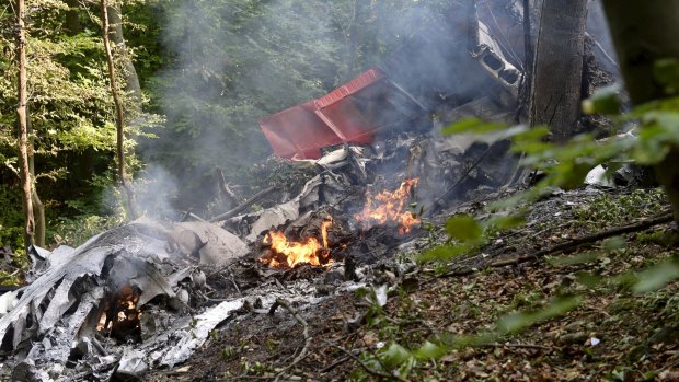 Debris of two sport planes is seen following the mid-air collision.