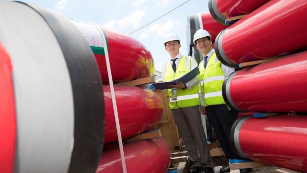 Envac Korea senior manager Daniel Parks and CEO Stephen Bahng Parks inspect pipes that have arrived to form Australia's first underground waste disposal network.