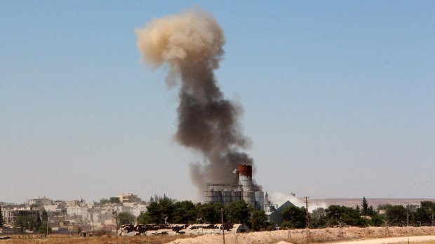 Smoke billows from Kobane on Thursday.