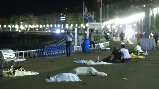 Bodies are seen on the ground after at least 84 people were killed in Nice.