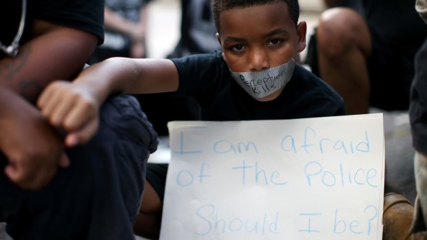 A young boy holds at a Black Lives Matter protest in Atlanta on Saturday.