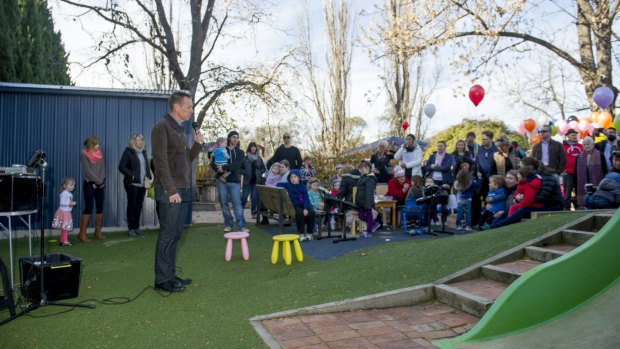 ACT Greens minister Shane Rattenbury speaks to the crowd at the Manuka Occasional Childcare Centre on Sunday. 