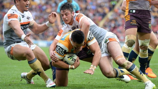 Bronco beatdown: Alex Glenn goes over during the big win over Wests Tigers. 