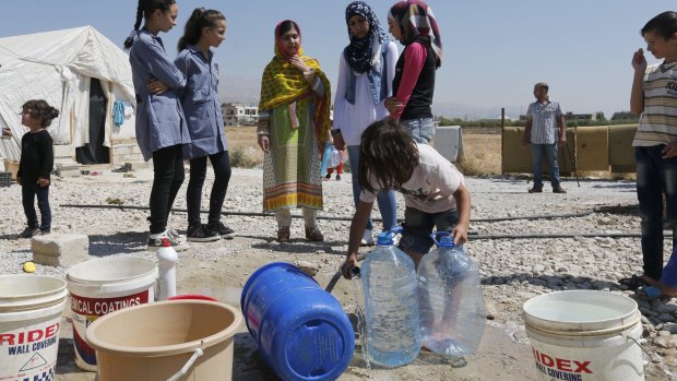Malala (centre) at Abrar Syrian refugee informal settlement in Lebanon's Bekaa Valley on Sunday.