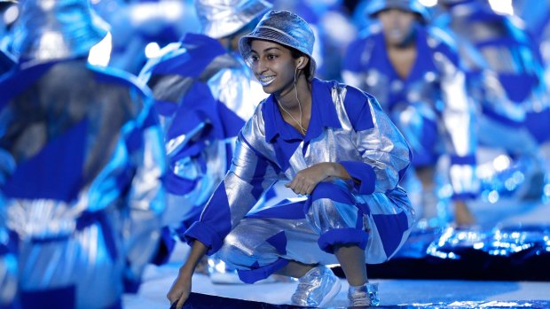 A performer dances during the ceremony.