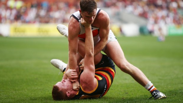 Hard-fought win: Crows Tom Lynch and Giants Heath Shaw scuffle.