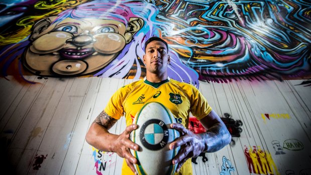 Difference maker: Wallabies fullback Israel Folau poses in front of The Rialto's graffiti wall in Melbourne before the second Cook Cup Test against England at AAMI Park. 