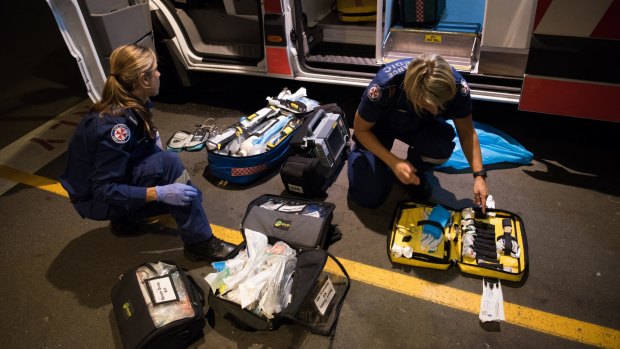 NSW Ambulance paramedics restock their medical kits at St Vincent's Hospital.