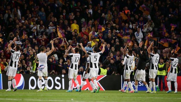 Juventus players celebrate with their fans after the second leg.