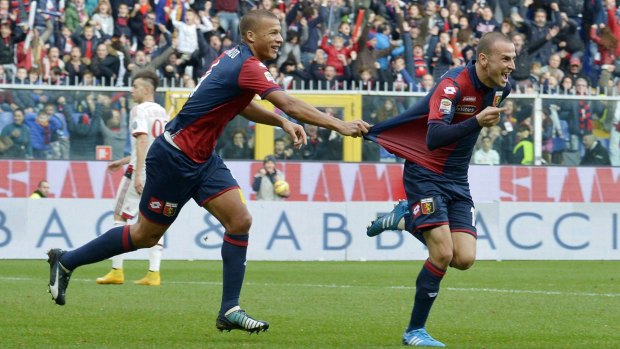 Genoa's Luca Antonelli  celebrates his goal.