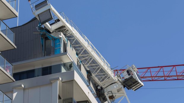 The penthouse apartment was destroyed by the crane's horizontal arm.