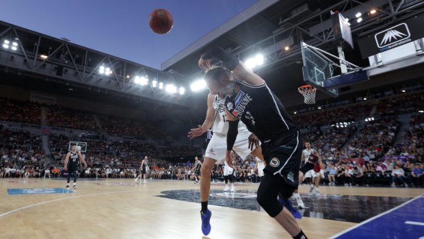 David Andersen of Melbourne flicks the ball back into play under the open roof during the Round 12 NBL game between Melbourne United and Brisbane Bullets at Hisense Arena in Melbourne.