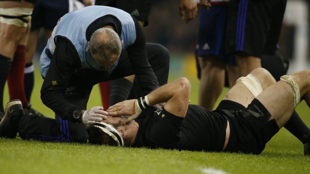Richie McCaw receives treatment on the pitch.