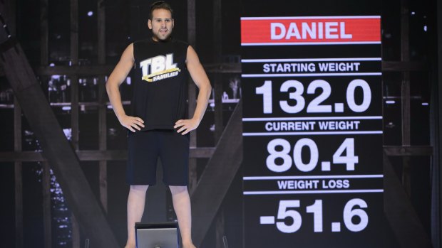 Daniel Jofre stands on the scale on The Biggest Loser: Families finale. 