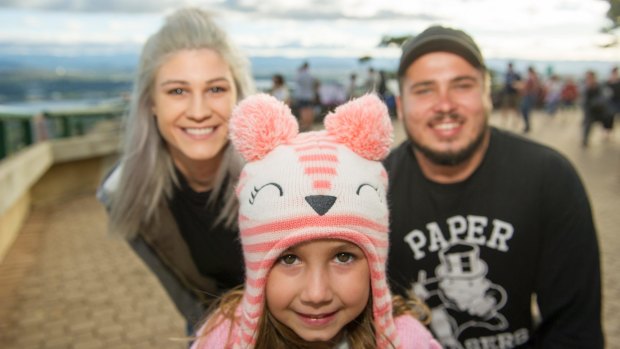 Jack Bush, Tayla Morris and Miah Newton, 5, up on Mount Ainslie finding a prime spot to watch the fireworks.