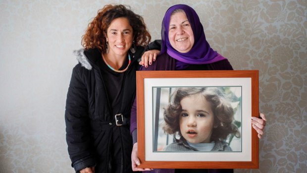Bianca Elmir with her mother Diana Abdel-Rahman holding photo of her as a child.