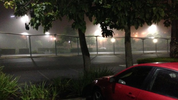 Fog smothers the bus station at Eight Mile Plains in Brisbane about 4.30am.