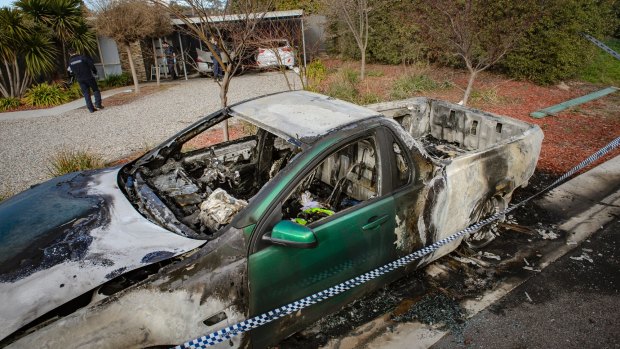 Police arrived at the home to find three cars on fire. 