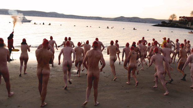 Grin and bare it: Hundreds turn out for Dark Mofo's 2015 Nude Solstice Swim in Hobart's Derwent.
